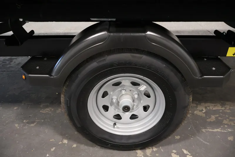 Slide: The Image of Trailer wheel of 2026 Sea-Doo Switch Fish 18, featuring a sturdy black fender. - 51