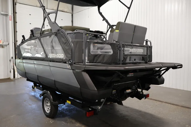 Slide: The Image of 2026 Sea-Doo Switch Fish 18 pontoon boat on trailer in indoor setting. - 14