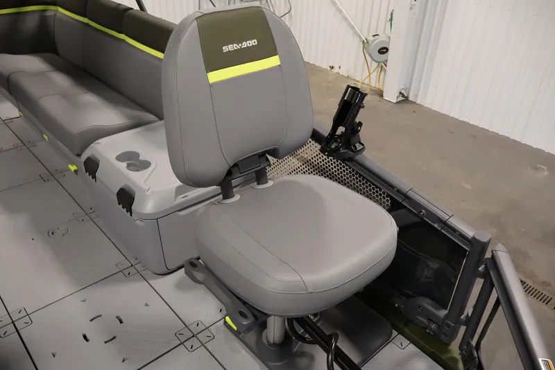 Slide: The Image of 2026 Sea-Doo Switch Fish 18 interior with gray seating and fishing rod holder. - 18