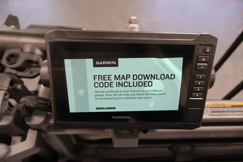 Slide: The Image of Garmin display on 2026 Sea-Doo Switch Fish 18, showing free map download code offer. - 23