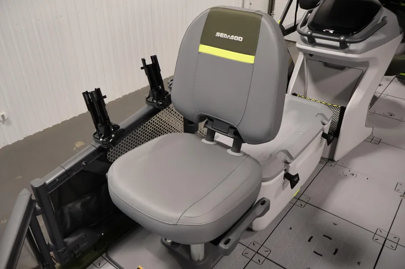 Slide: The Image of 2026 Sea-Doo Switch Fish 18 interior with gray seating and fishing rod holders. - 19