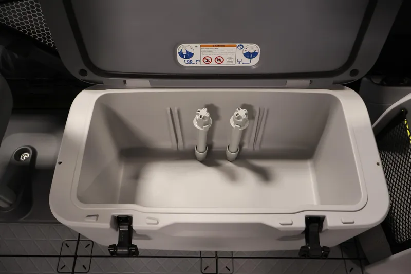 Slide: The Image of 2026 Sea-Doo Switch Fish 18 storage compartment with open lid and secure latches. - 25