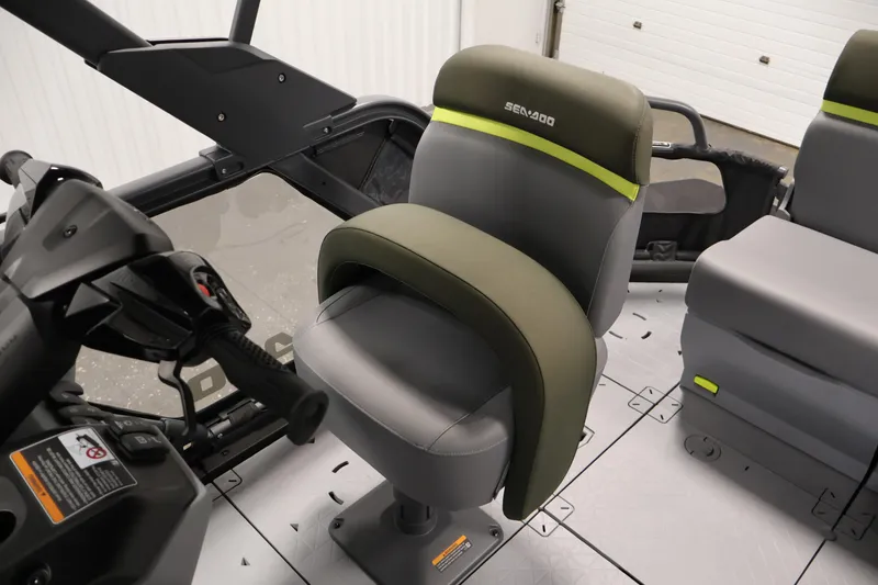 Slide: The Image of 2026 Sea-Doo Switch Fish 18 interior with ergonomic seating and modern controls. - 40