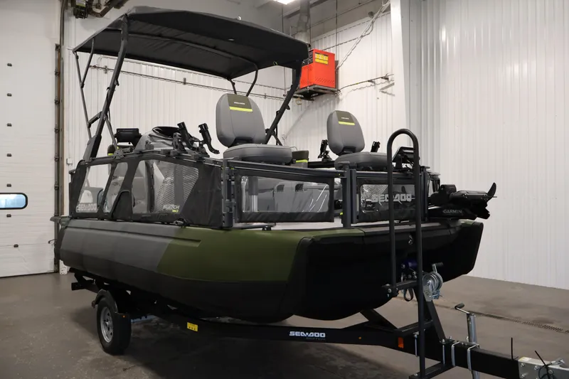Slide: The Image of 2026 Sea-Doo Switch Fish 18 pontoon boat in a garage setting. - 10
