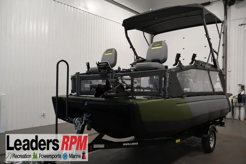 The Image of 2026 Sea-Doo Switch Fish 18 pontoon boat in indoor showroom setting. - 8