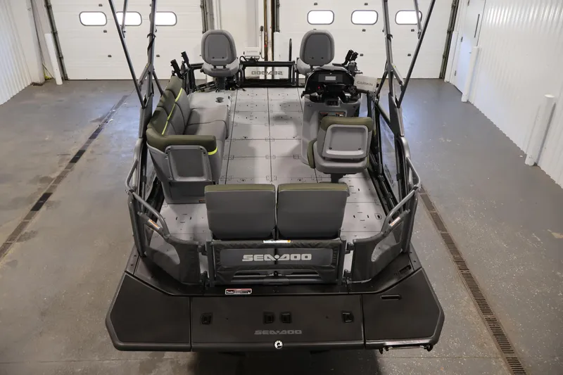 Slide: The Image of 2026 Sea-Doo Switch Fish 18 pontoon boat interior in a garage setting. - 17