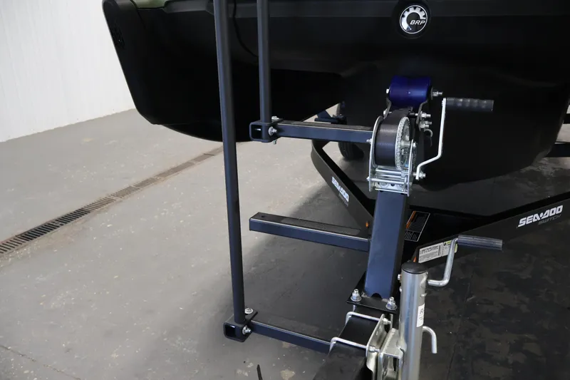 Slide: The Image of 2026 Sea-Doo Switch Fish 18 trailer hitch and winch mechanism in a garage setting. - 48