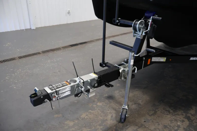 Slide: The Image of Trailer hitch of 2026 Sea-Doo Switch Fish 18 in a garage setting. - 49
