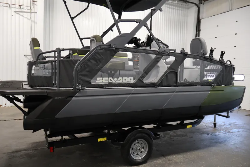 Slide: The Image of 2026 Sea-Doo Switch Fish 18 pontoon boat in a garage setting. - 11