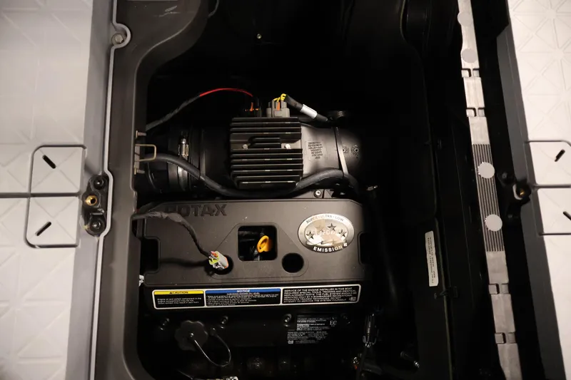 Slide: The Image of Engine compartment of 2026 Sea-Doo Switch Fish 18, showcasing Rotax engine components. - 54