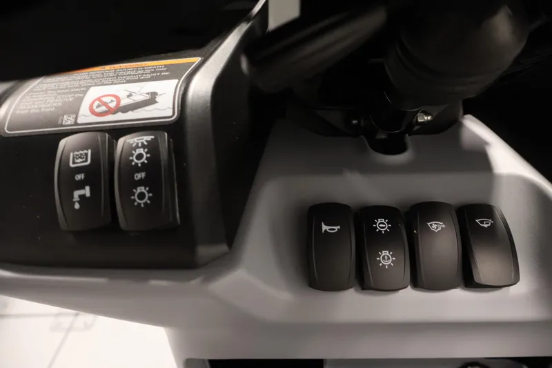 Slide: The Image of Control panel of 2026 Sea-Doo Switch Fish 18 with various function buttons. - 37