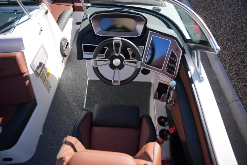 Slide: The Image of 2019 MasterCraft XT22 boat interior with modern dashboard and steering wheel. - 19