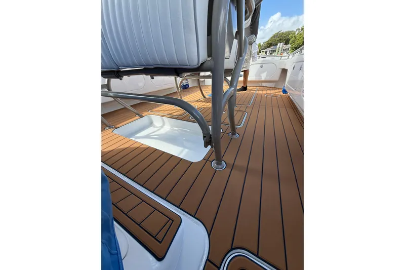 Slide: The Image of Boat interior with teak flooring, featuring seating and metal supports, Don Smith 45 model, 2008. - 20