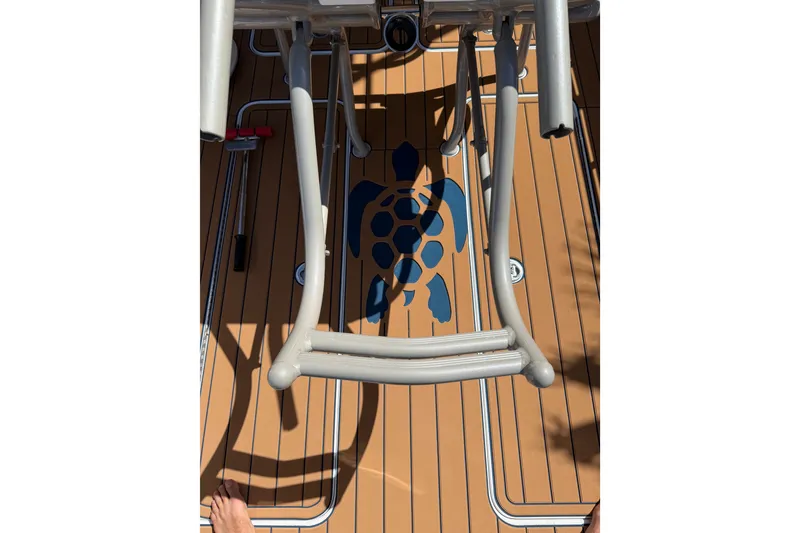 Slide: The Image of Boat deck with turtle design, featuring metal structures, Don Smith 45, 2008 model. - 21