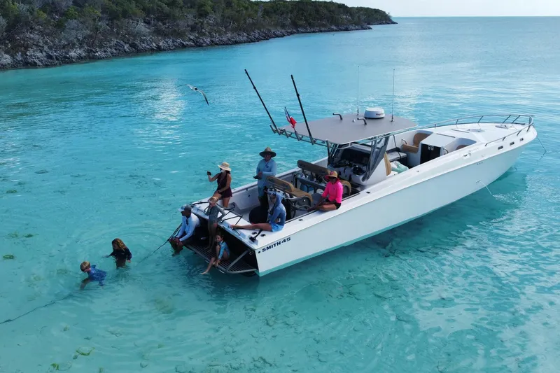 Slide: The Image of People enjoying a day on a 2008 Don Smith 45 boat in clear turquoise waters. - 3