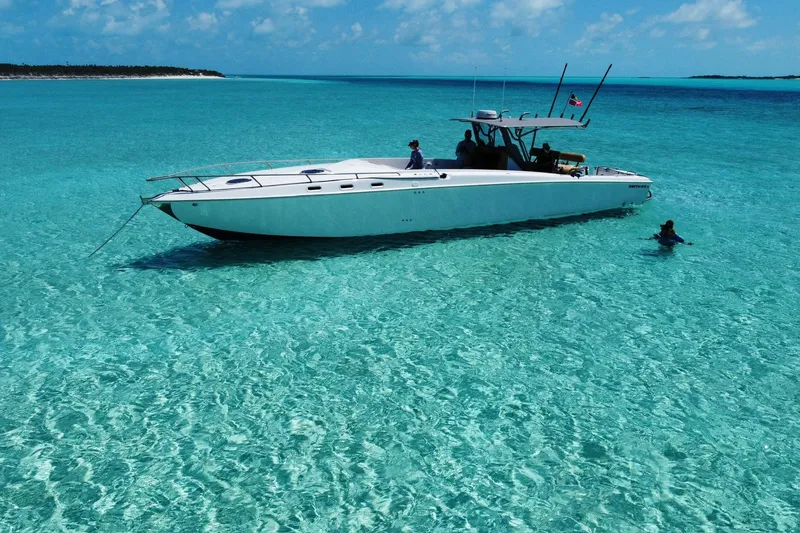 Slide: The Image of A 2008 Don Smith 45 boat anchored in clear turquoise waters under a sunny sky. - 4