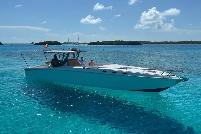 Slide: The Image of A 2008 Don Smith 45 boat cruising on clear turquoise waters under a sunny sky. - 6