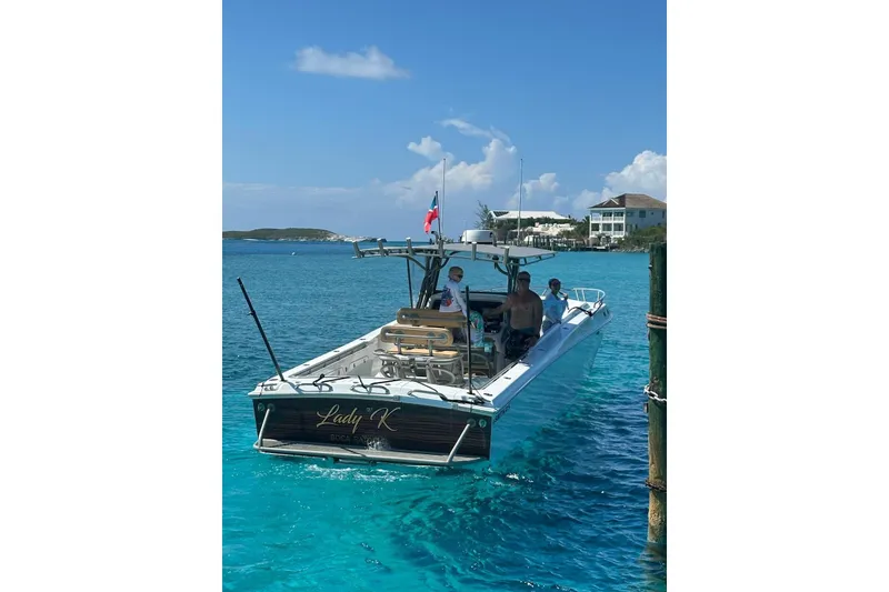 Slide: The Image of Boat "Lady K" by Don Smith, model 45, 2008, on clear blue water. - 7