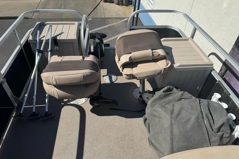 Slide: The Image of 2019 Sun Tracker Bass Buggy 16 DLX interior with seating and storage compartments. - 10