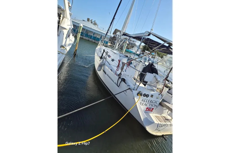 The Image of 2005 Beneteau Oceanis Clipper 373 sailboat docked, labeled "Allergic Reaction," for sale. - 0