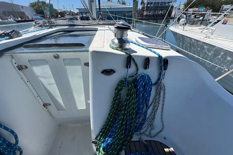 Slide: The Image of 2005 Beneteau Oceanis Clipper 373 sailboat cockpit with ropes and winch. - 14
