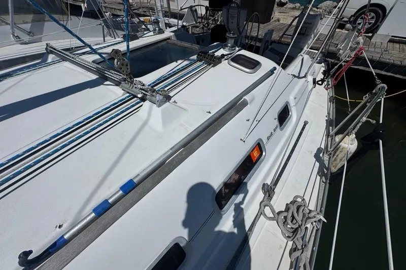 Slide: The Image of 2005 Beneteau Oceanis Clipper 373 sailboat docked, showcasing deck and rigging details. - 28