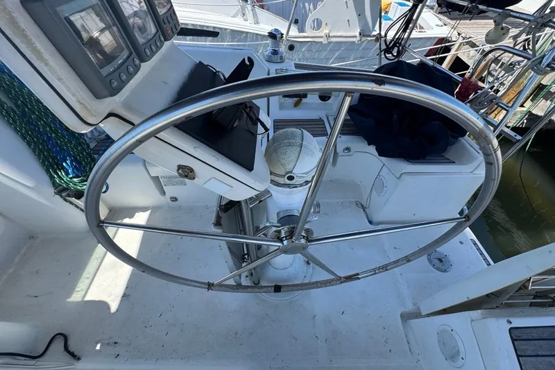Slide: The Image of Steering wheel of a 2005 Beneteau Oceanis Clipper 373 sailboat cockpit. - 29