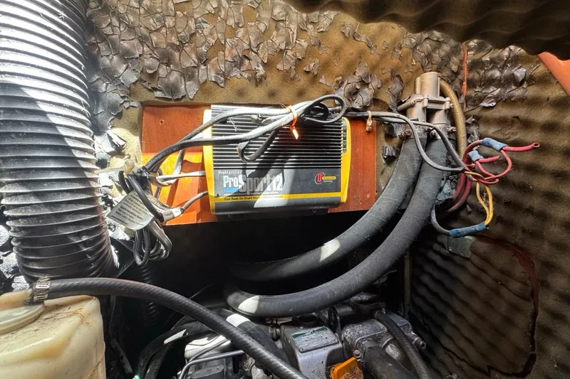 Slide: The Image of Engine compartment of a 2005 Beneteau Oceanis Clipper 373 with ProMariner ProSport12 charger. - 33