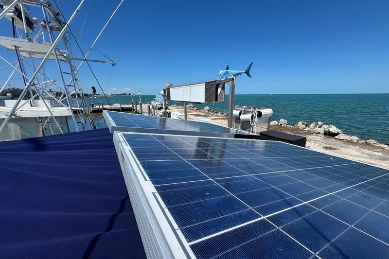 Slide: The Image of Solar panels on a 2005 Beneteau Oceanis Clipper 373 by the sea. - 36