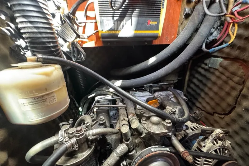 Slide: The Image of Engine compartment of a 2005 Beneteau Oceanis Clipper 373 sailboat, showing mechanical components. - 48