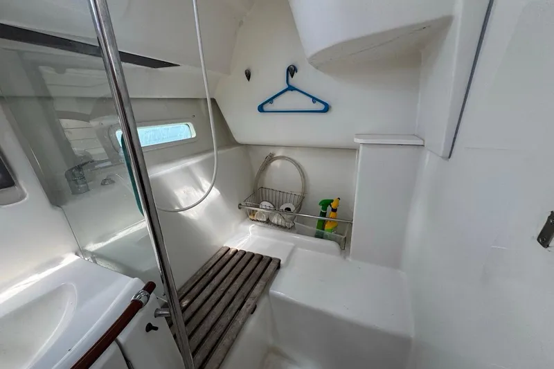 Slide: The Image of Interior of 2005 Beneteau Oceanis Clipper 373 yacht bathroom with shower and storage. - 50
