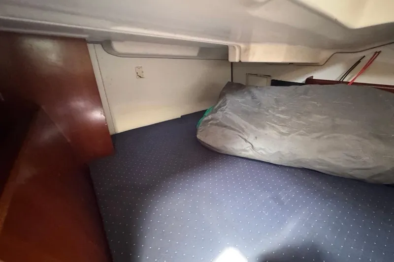 Slide: The Image of Interior cabin of 2005 Beneteau Oceanis Clipper 373 sailboat, featuring a cozy sleeping area. - 52