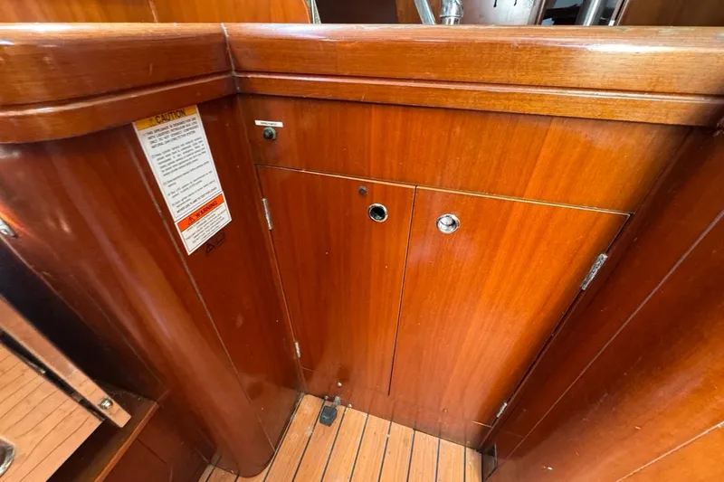 Slide: The Image of Wooden interior of 2005 Beneteau Oceanis Clipper 373 sailboat, featuring storage cabinets. - 53