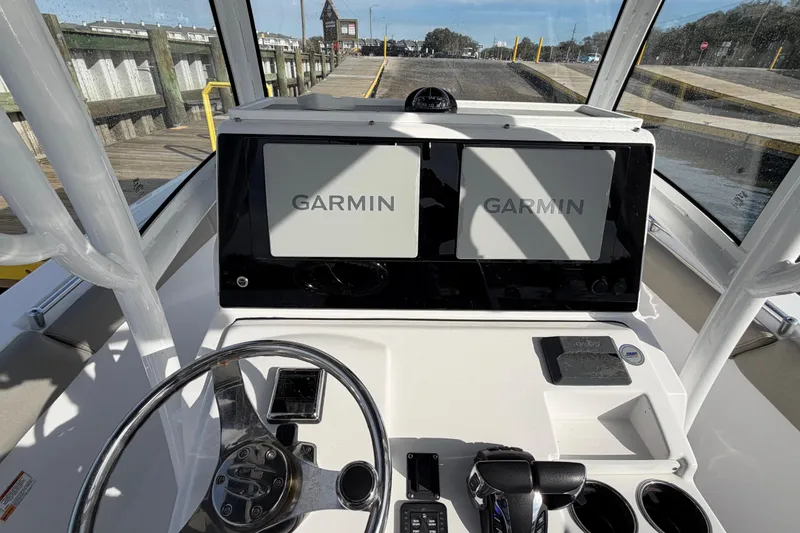 Slide: The Image of 2021 Sportsman Heritage 251 Center Console with dual Garmin displays at the helm. - 25