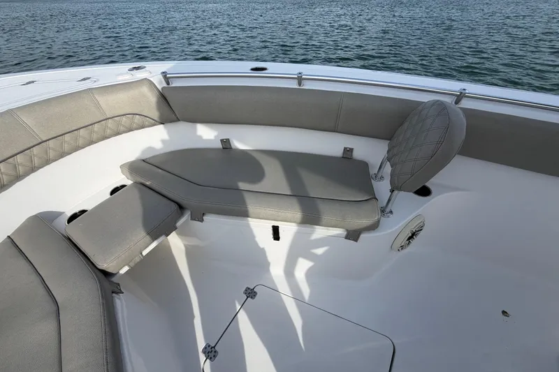 Slide: The Image of 2021 Sportsman Heritage 251 Center Console boat interior with cushioned seating. - 27