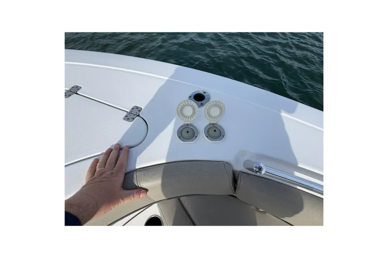 Slide: The Image of 2021 Sportsman Heritage 251 Center Console boat deck with hand and cup holders. - 31