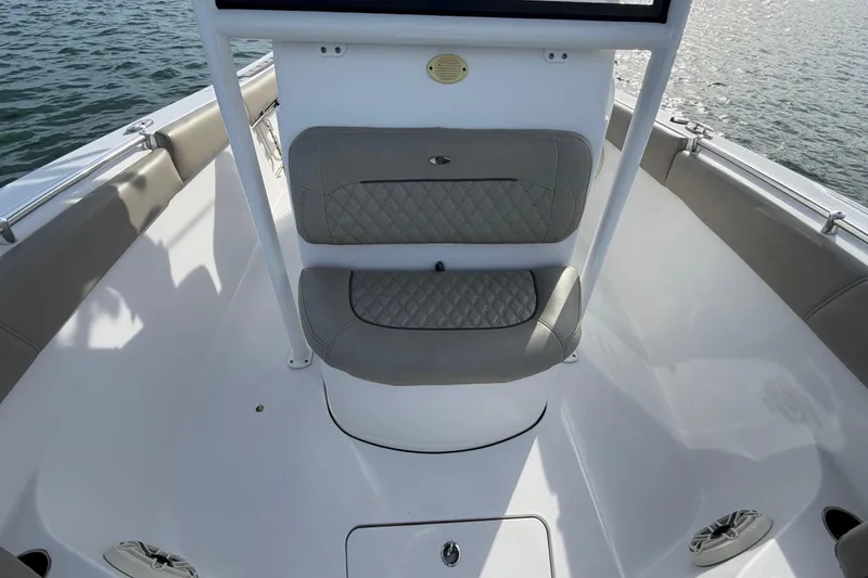 Slide: The Image of 2021 Sportsman Heritage 251 Center Console boat interior with cushioned seating. - 34