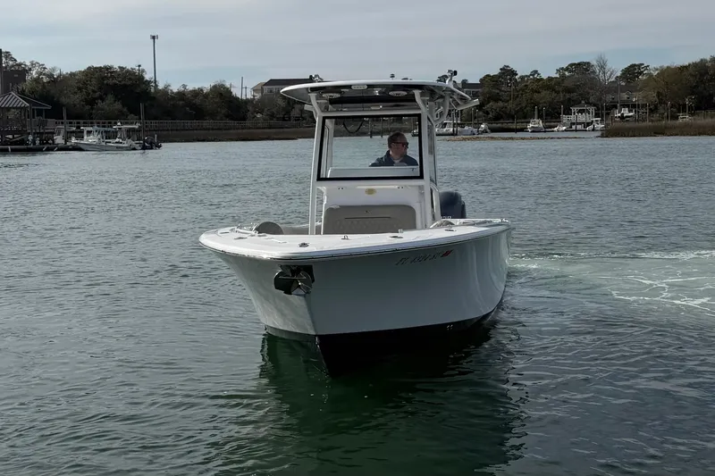 Slide: The Image of 2021 Sportsman Heritage 251 Center Console boat on calm water. - 4