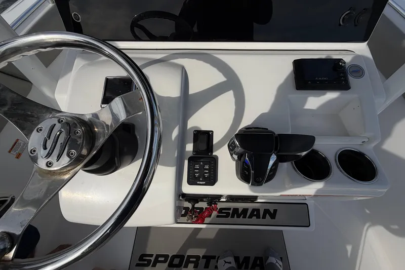 Slide: The Image of 2021 Sportsman Heritage 251 Center Console dashboard with steering wheel and controls. - 42