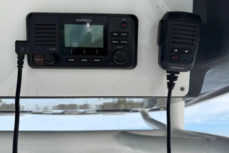 Slide: The Image of Garmin marine radio system on 2021 Sportsman Heritage 251 Center Console boat. - 47