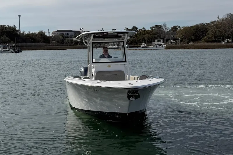 Slide: The Image of 2021 Sportsman Heritage 251 Center Console boat on calm water. - 5