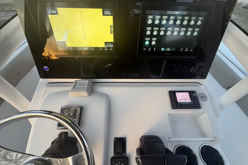 Slide: The Image of 2021 Sportsman Heritage 251 Center Console dashboard with navigation and control displays. - 58