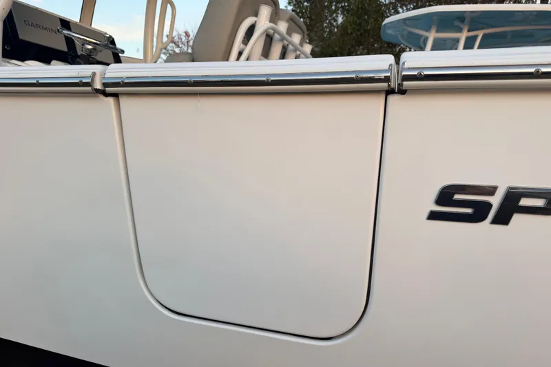 Slide: The Image of 2021 Sportsman Heritage 251 Center Console boat side view with logo detail. - 60