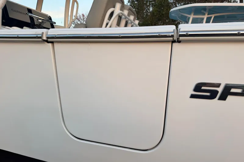 Slide: The Image of 2021 Sportsman Heritage 251 Center Console boat side view with logo detail. - 61