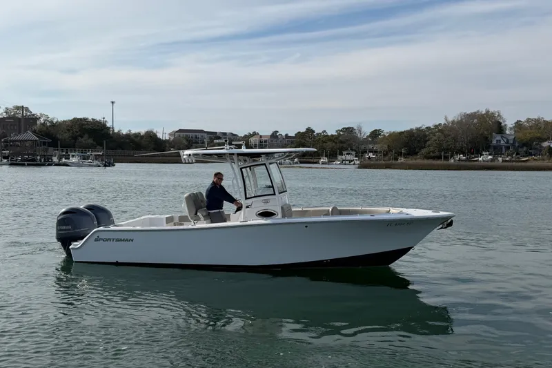 Slide: The Image of 2021 Sportsman Heritage 251 Center Console boat on calm water, side view. - 9