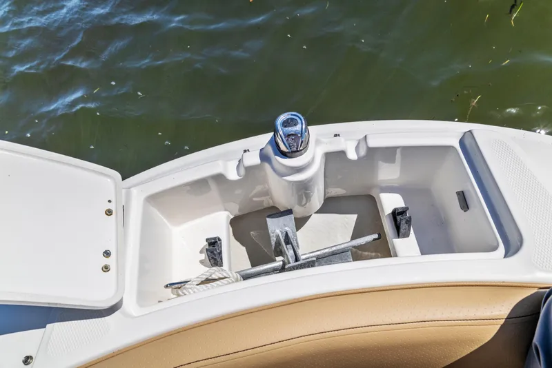 Slide: The Image of 2024 Sea Ray SPX 230 Outboard anchor storage compartment with water view. - 30