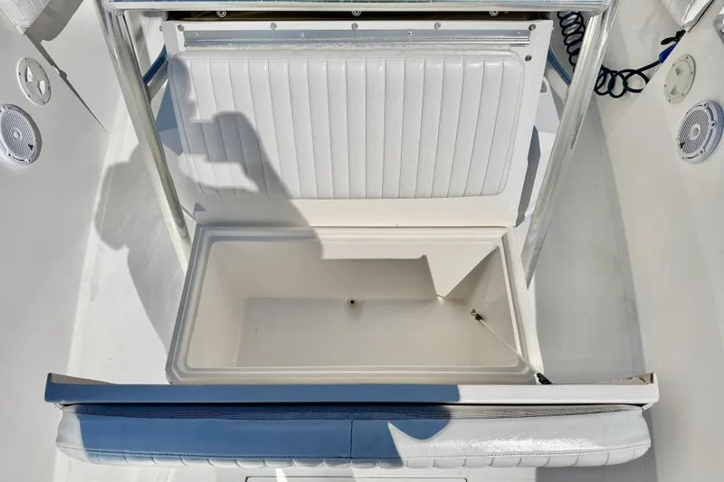 Slide: The Image of Open storage compartment on a 2003 Contender 21 Open boat, featuring white interior. - 10