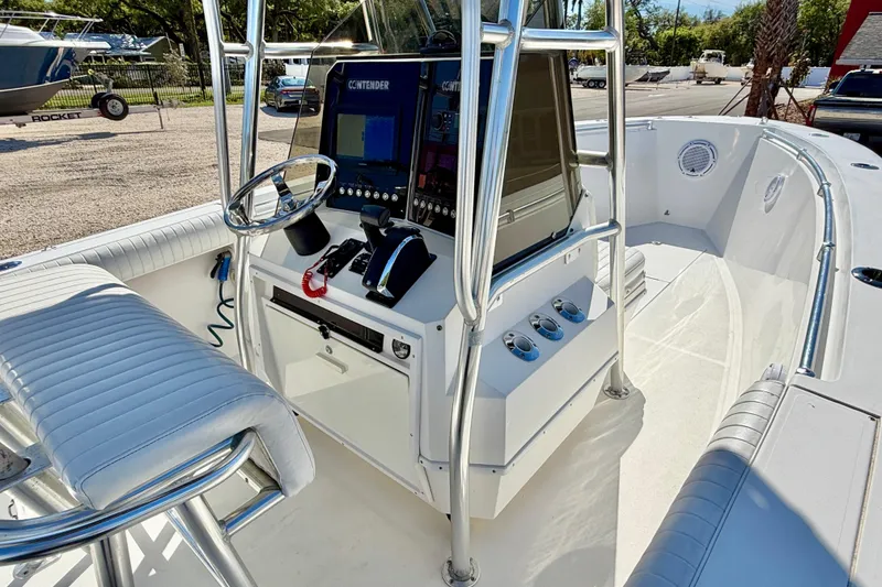 Slide: The Image of 2003 Contender 21 Open boat interior with steering console and seating. - 11