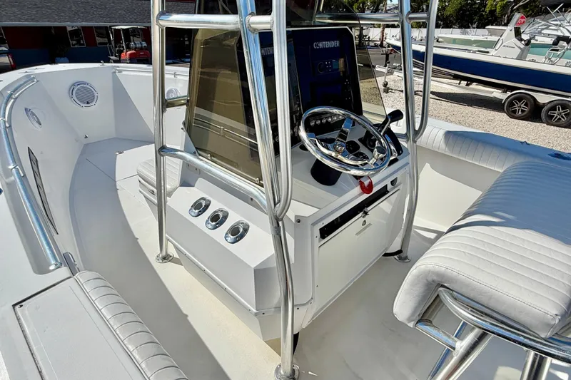 Slide: The Image of 2003 Contender 21 Open boat interior with steering console and seating. - 12