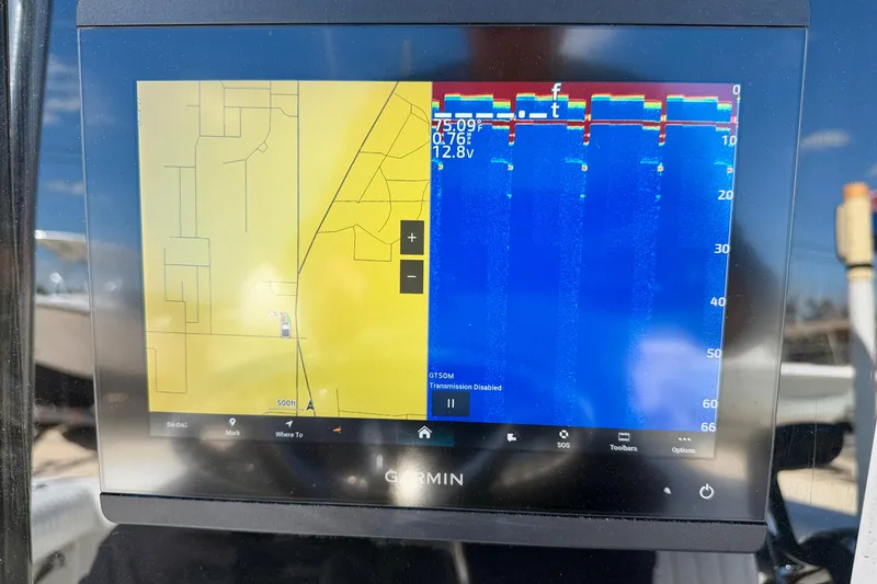 Slide: The Image of Garmin marine GPS display on a 2003 Contender 21 Open boat, showing navigation and sonar data. - 16
